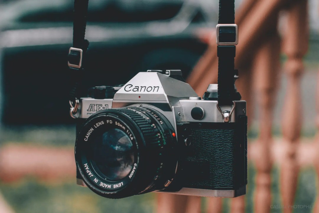 Canon AE1 Program Film Camera on a strap